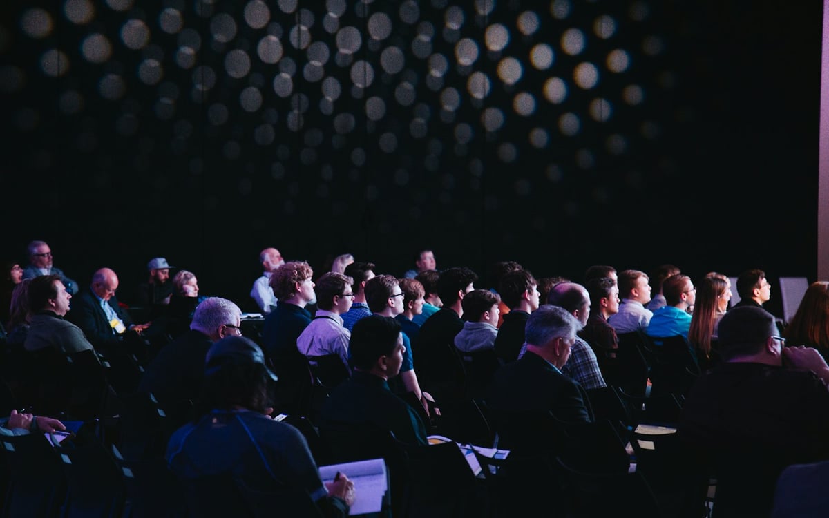 Attendees listening to a keynote