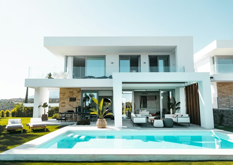 White villa with a pool and terrace
